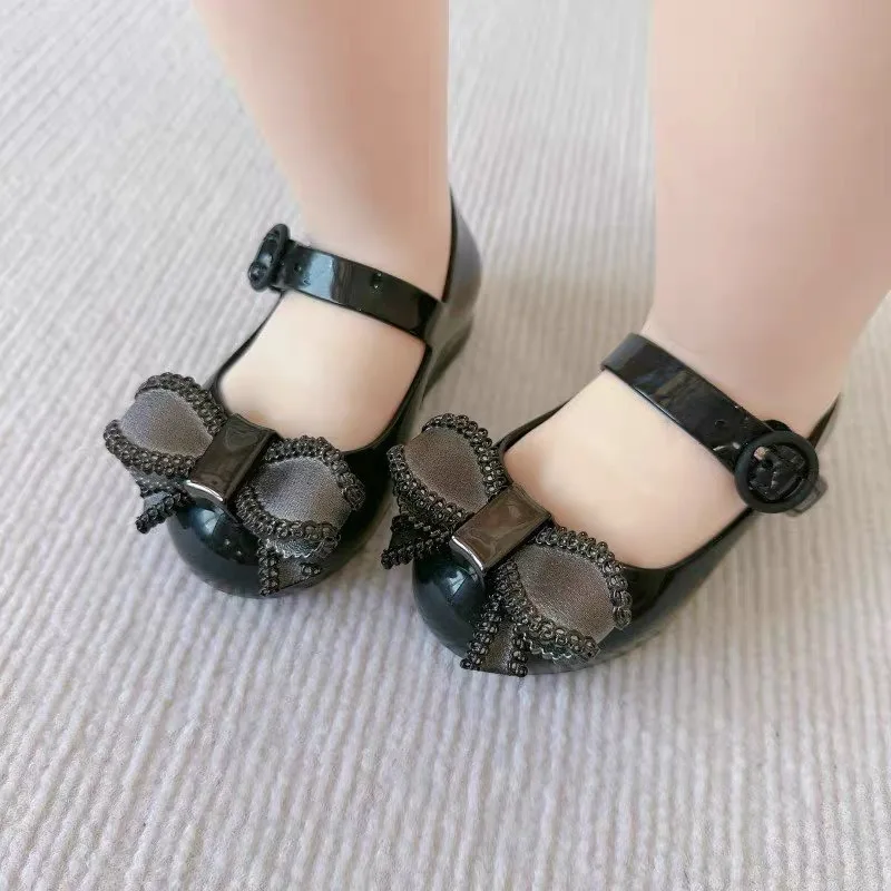 Mini Melissa sandali estivi per ragazze fiocco antiscivolo suola morbida Versatile solido coreano bambini dolci scarpe da principessa sandali da