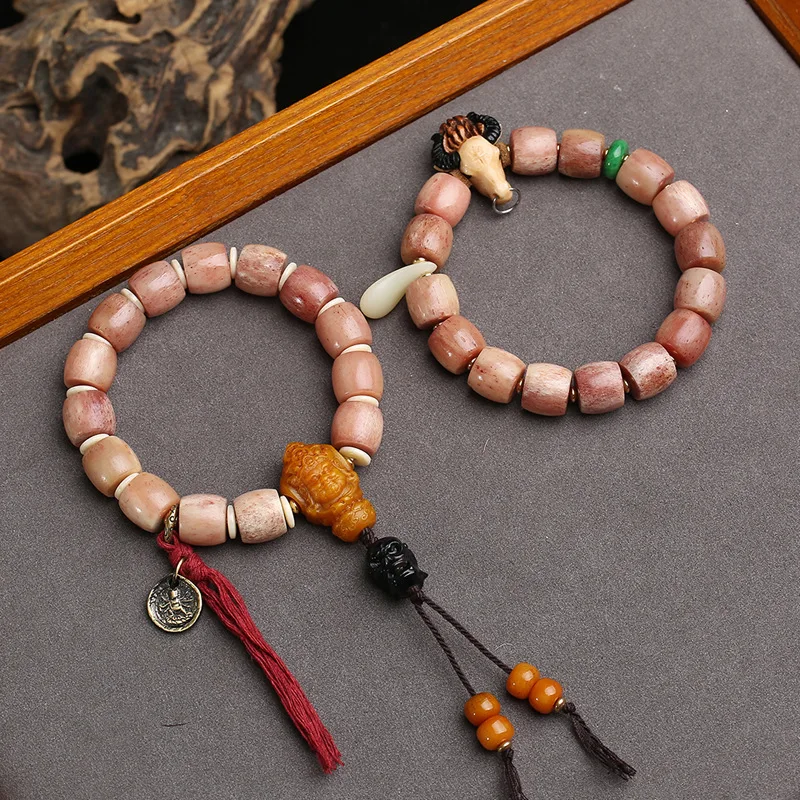 

Single-strand camel bone bracelet with natural, unpolished “full-blood” barrel beads and stag horn agate
