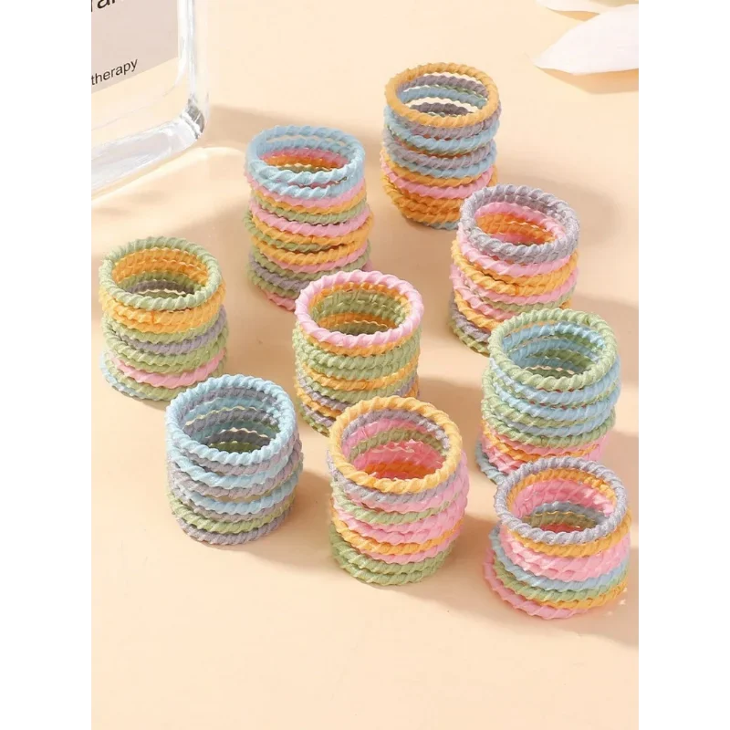 Banda de goma colorida para bebé, piezas de 2cm, no daña el cabello, anillo pequeño para el pulgar, hilo elástico alto, juego de Scrunchies para niños pequeños, 100