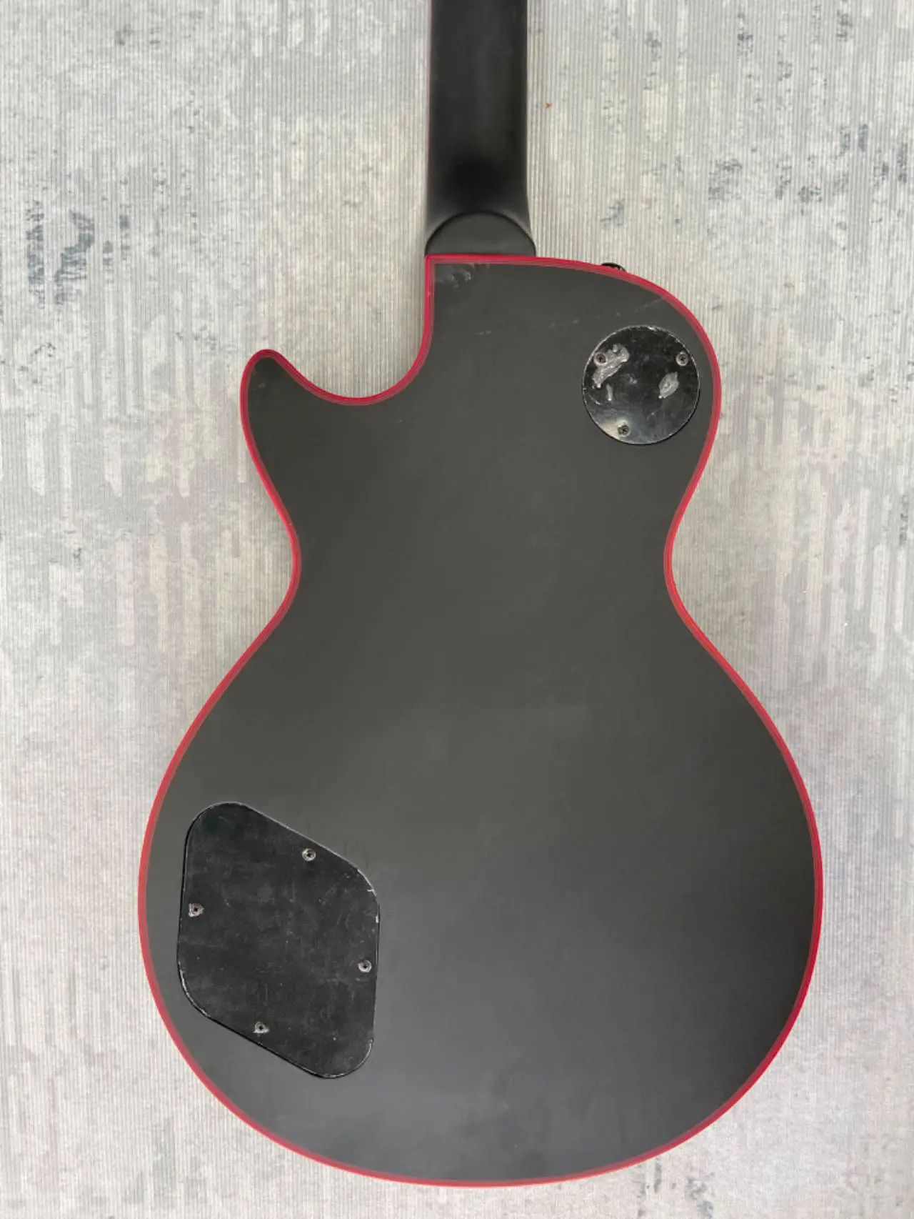 have Gib~ logo Electric Guitar, Black, Red binding, Red logo Jacob, Mahogany body, Rosewood fingerboard Made in China,