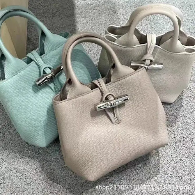 

Luxury Vegan Leather Bucket Bag 2024, Detachable Bamboo Shoulder Strap & RFID Protection (Trendy Colors)