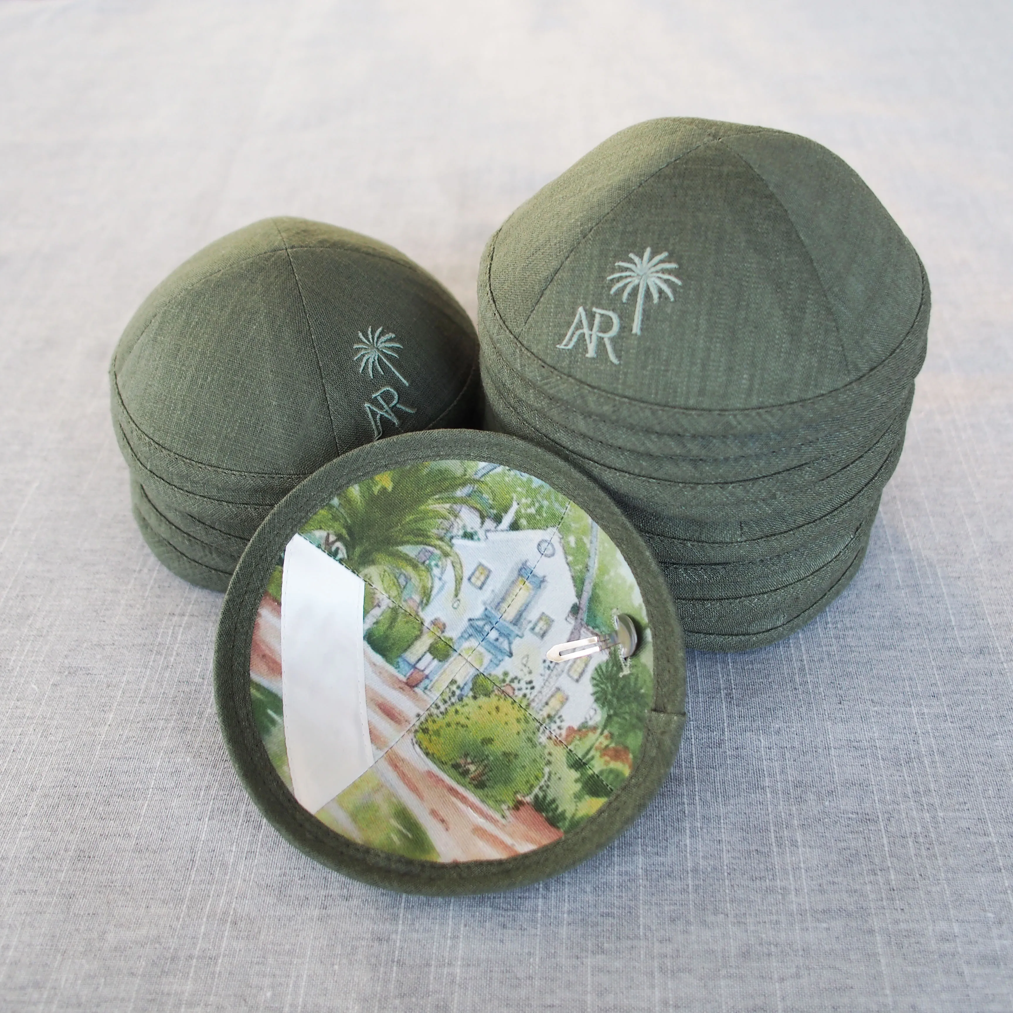 

Custom embroidered dark green linen kippah with custom digital printing. Suitable for weddings and bar mitzvahs / bat mitzvahs.