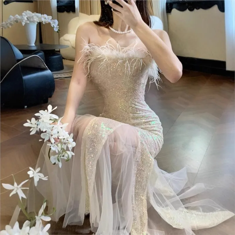 

A new strapless dress with cinched waist and fish tail presenting stylish long style for students taking the art examination