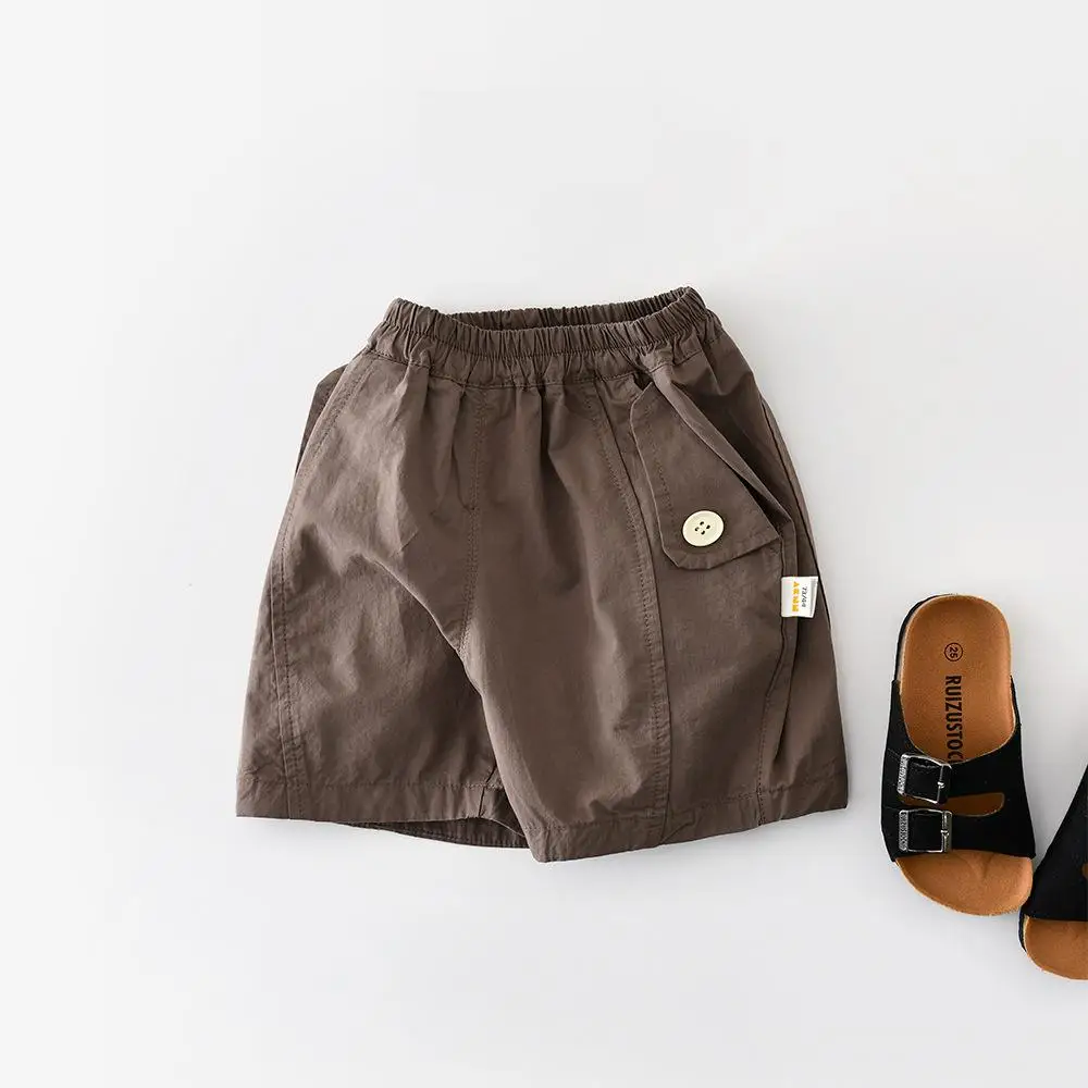 

Летние новые повседневные шорты для малышей 2026 года: однотонные свободные шорты для мальчиков, тонкие хлопковые шорты-карго для девочек, детская одежда