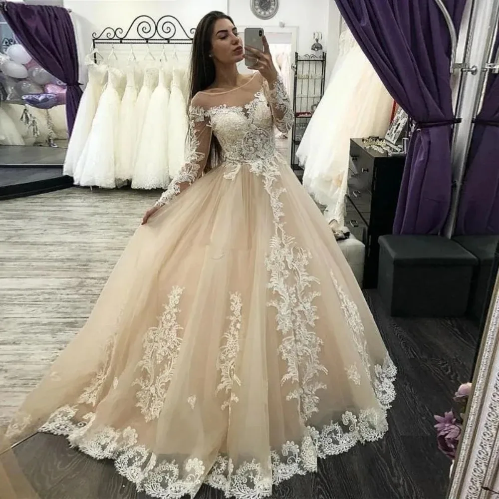 Eleganti abiti da sposa Champagne a-line trasparenti scollo tondo manica lunga Appliques bottone indietro abito da sposa Boho Vestido De Novia