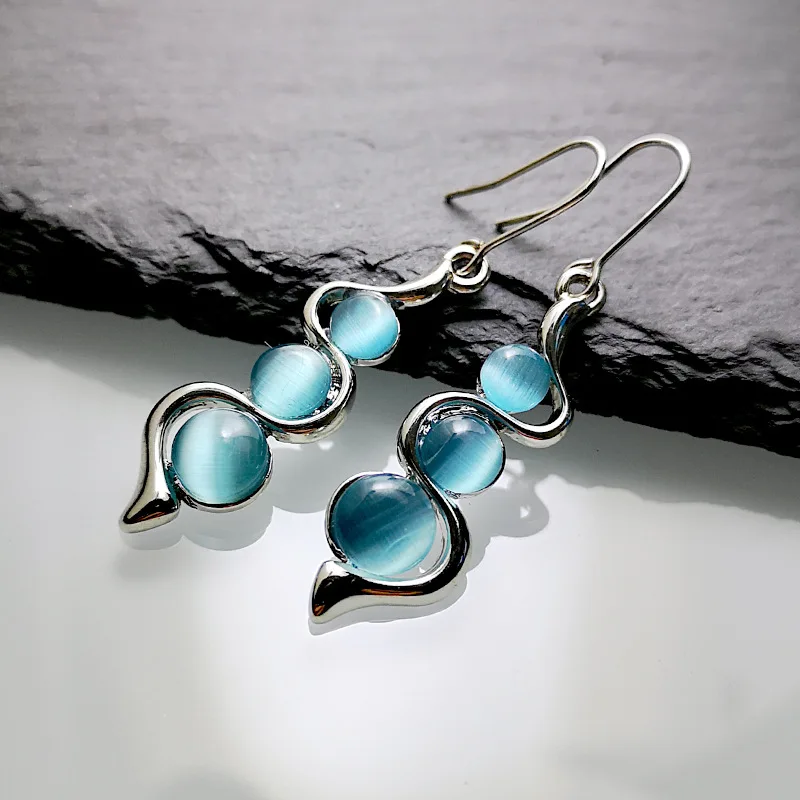 

Bohemian Creative Curved Wavy Earrings Inlaid Hylan Cat's Eye Gemstone Swinging Earrings Baby Blue Curved Cat Eye Earrings