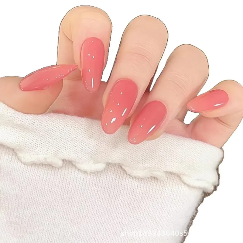 A set of Lina pink nail tips in a translucent nude color that enhances skin tone and is versatile for everyday wear