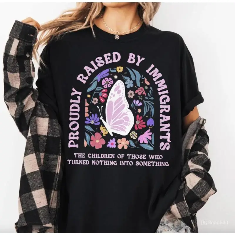 

Proudly Raised By Immigrants Shirt, Immigrant Rights Shirt, No Human Is Illegal Shirt, Social Justice Gift, Human Rights T-Shirt