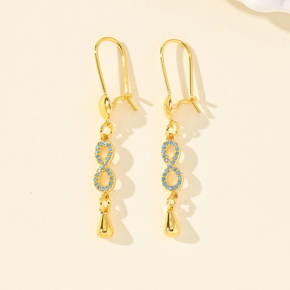 9999 gold European infinity symbol earrings with micro-set colored zirconia, fashionable and high-end ear accessories