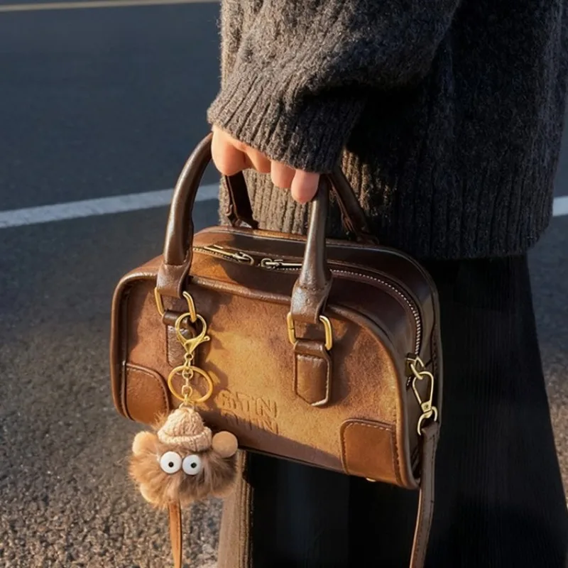 

Fashionable Maillard Female Bag Soft Touch PU Leather Woven Raffia + Metallic Accent Campus Students Bag