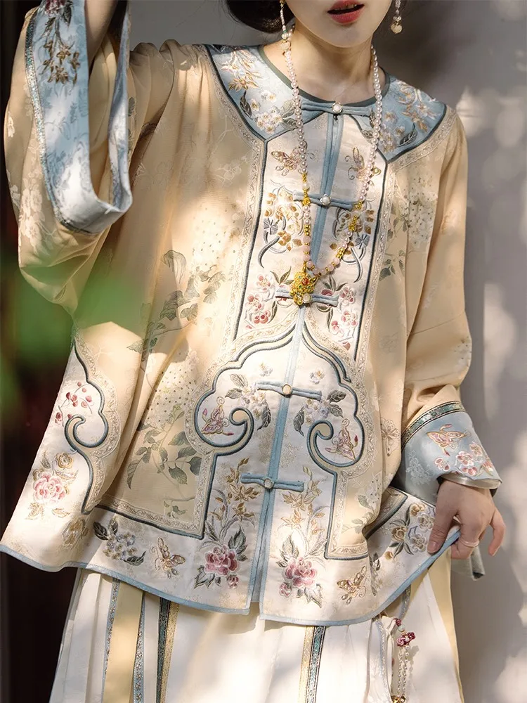 

A Chinese-style restoration wide-sleeved top with heavy embroidery and skirt set