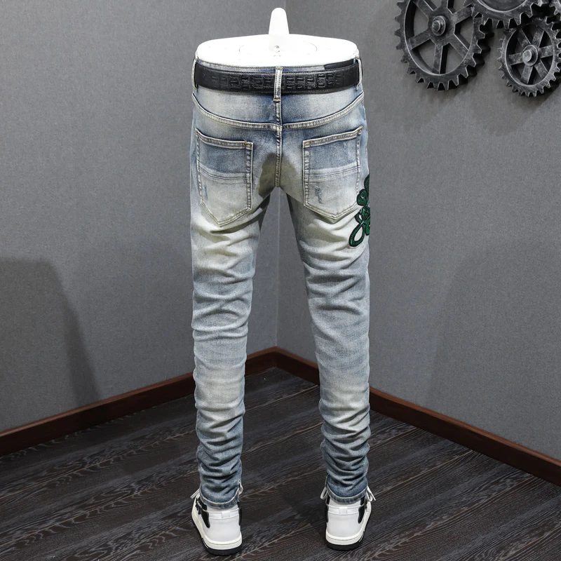 جينز Ashion Men'sy2k مع ثلاثة رؤوس بنمط ثعبان مرن وقابل للتمدد بقصة ضيقة مغسول باللون الأزرق الفاتح للرجال الهيب هوب ريت