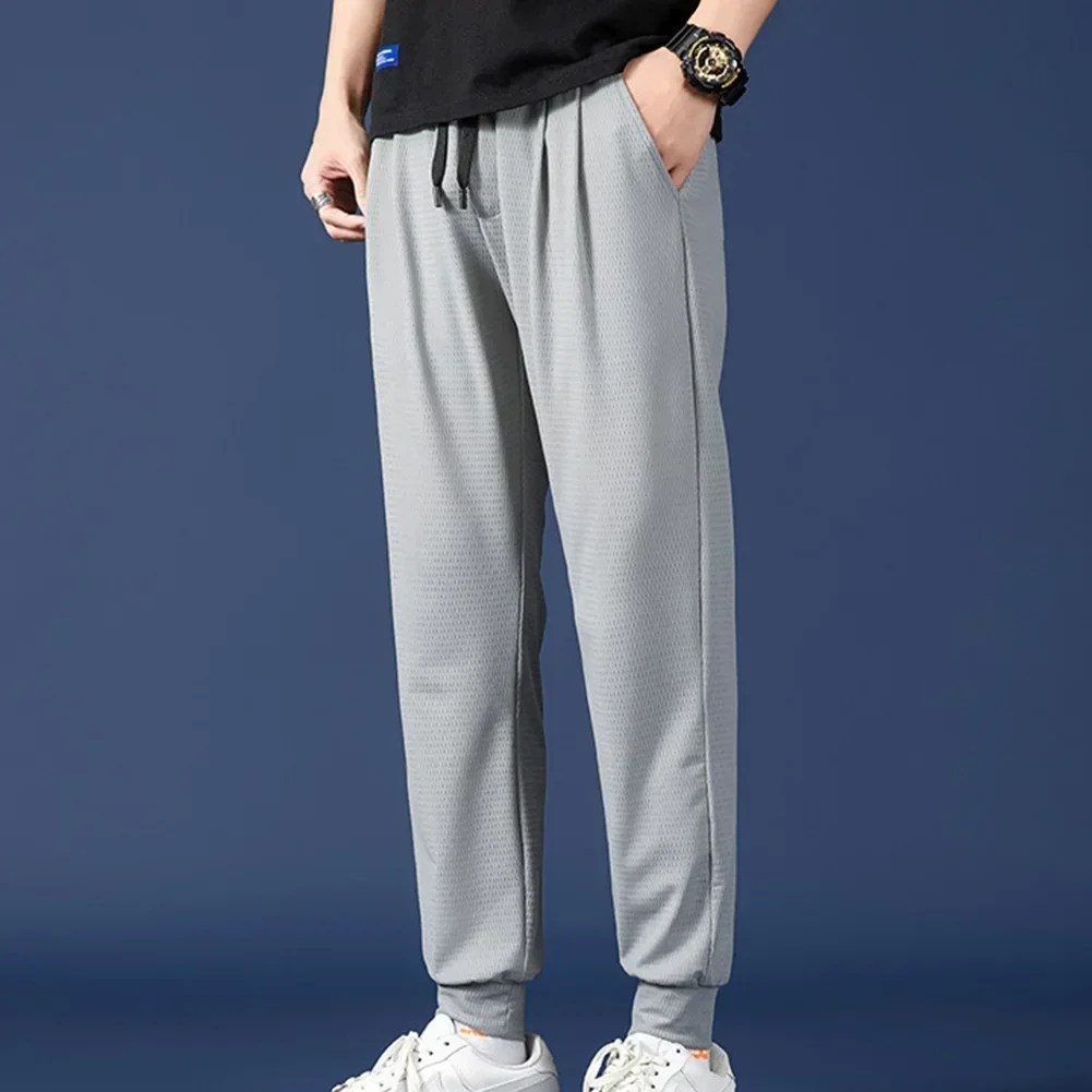 

Men's Loose Mesh Ice Silk Pants Spring And Summer Thin Breathable Sports Pants Plus Size Casual Simple Men's Cropped Pants