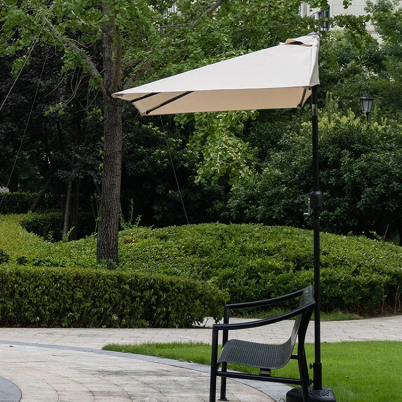 

Half umbrella outdoor against the wall umbrella balcony green plant parasol outside the cafe sun umbrella flowerbed