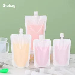 StoBag 100pcs Wholesale White Plastic Liquid Package Drinking Bags Nozzle Juice Beverage Seal Stand Up Storage Reusable Pouches