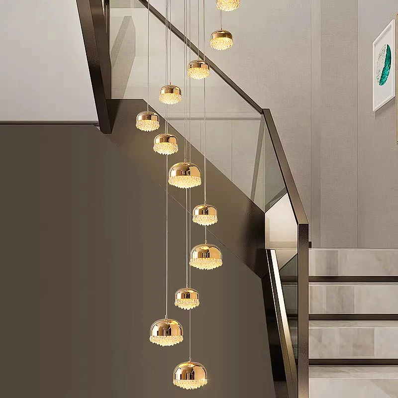 

Modern Crystal Cascade Chandelier - A dimmable luxury ceiling light with brilliant crystal lustre.Golden hardware living room