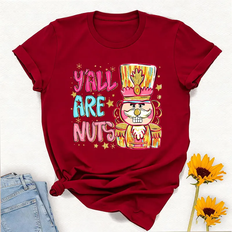 Y'all Are Nuts Coquette كسارة البندق Preppy عيد الميلاد Png السكر البرقوق الجنية المكسرات حول Brushstroke Crewneck تي شيرت مطبوع بلايز