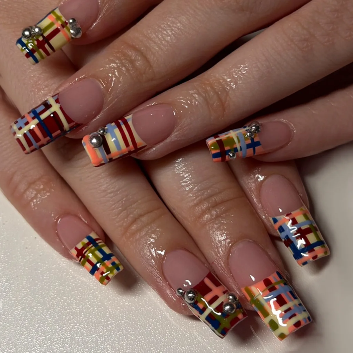 

24PCS Y2K Multicolor Plaid Press on Nails Medium Square Fake Nails with French Design Metallic Stud Accents Sweet Cool Manicure