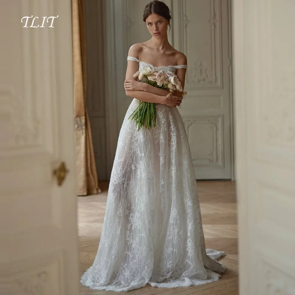 Luksusowe suknie ślubne w kształcie litery A z koronki TLIT, szyte na miarę, bez ramiączek, z odkrytymi ramionami i odkrytymi plecami.