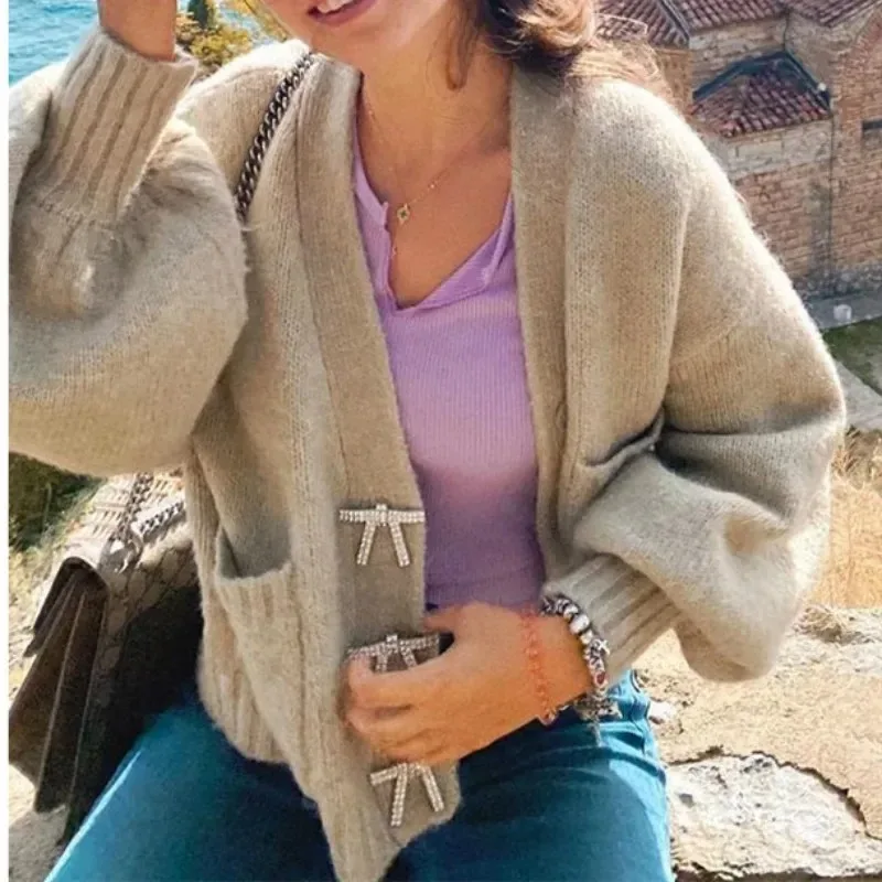 Maglione Casual da donna con scollo a v maniche a lanterna moda fiocco bottone Cardigan lavorato a maglia donna autunno e inverno nuovo maglione