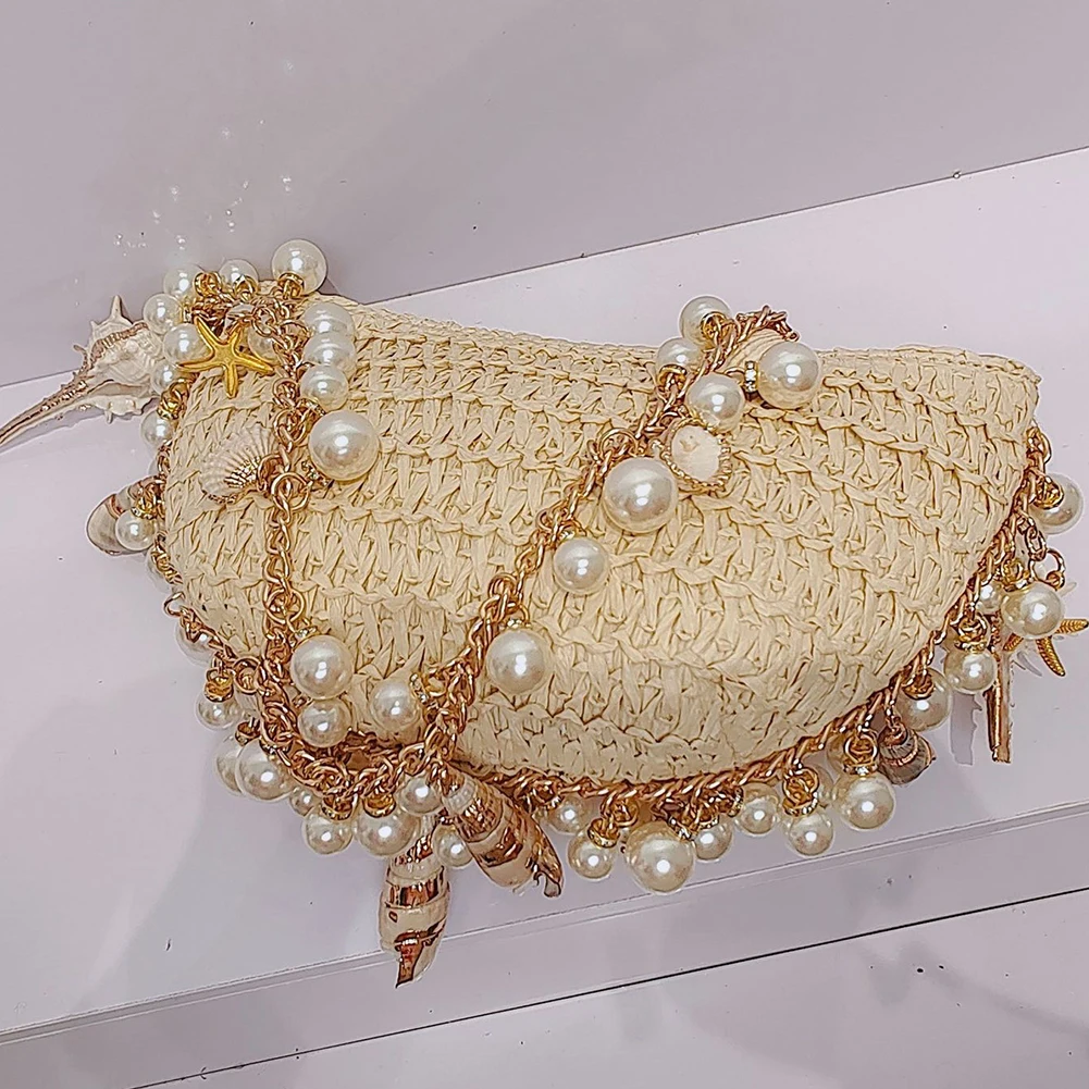 Bolso de hombro de paja elegante para mujer con cadena de perlas, bolso de playa para vacaciones, bolso de hombro con cuentas transpirable a la moda, bolso de mano suave junto al mar
