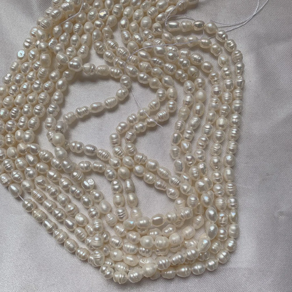 

Hot Sale 6-7mm Rice White Freshwater Pearls Strand Loose Beads for Jewelry Making