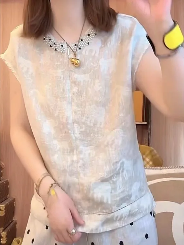 Ciężko zdobiona lniana bluzka lub sukienka damska letnia luźna plus size casual wyszczuplająca z efektem modelującym sylwetkę, haftowana.