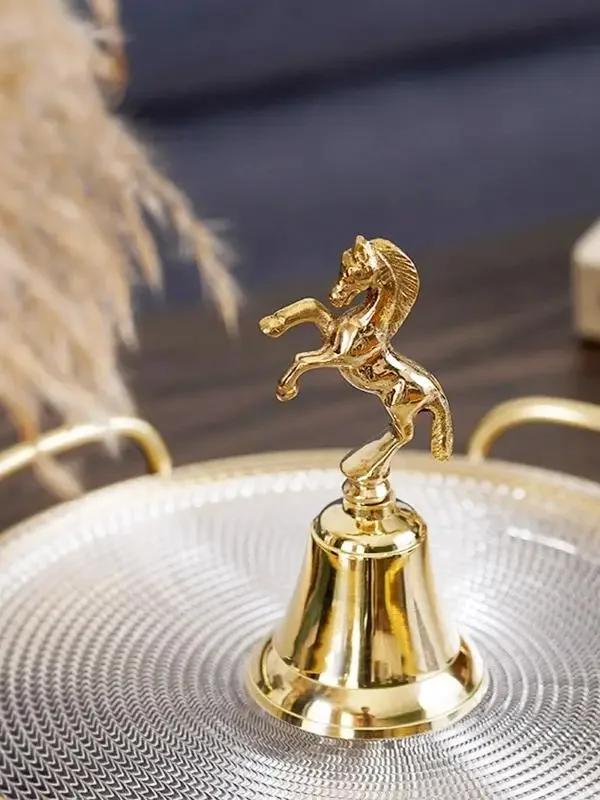 Fashionable light luxury brass horse-shaped dining bell artistic gold handcrank bell decoration ornament
