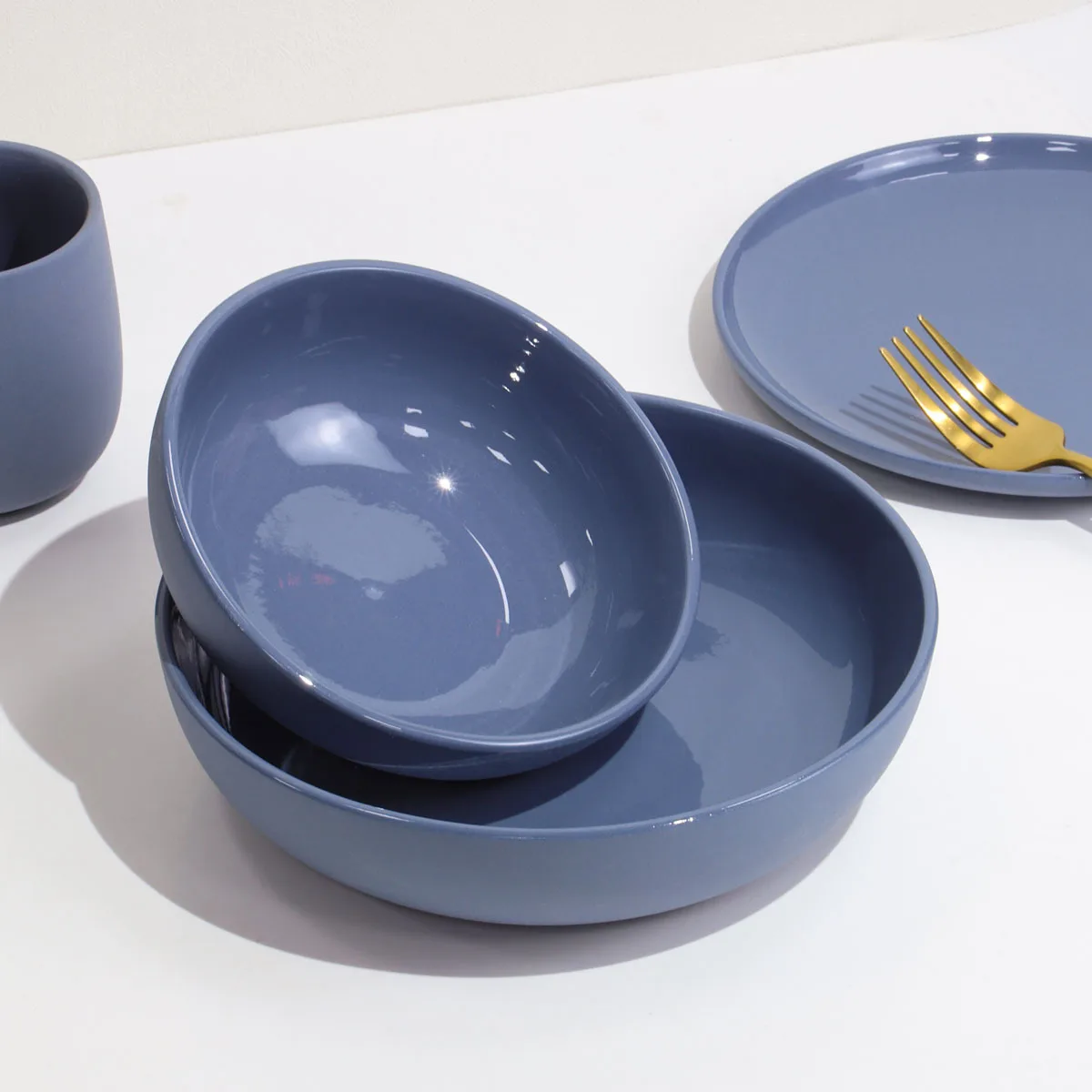 Set of ceramic tableware, blue and gray color, plates, household bowls, mugs, high-end tableware