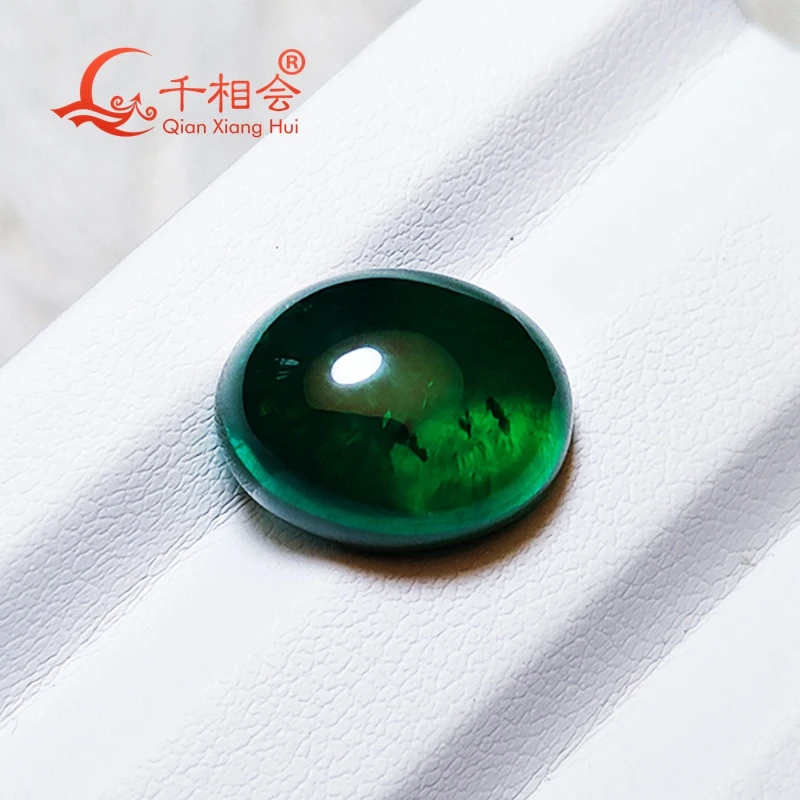 

Oval shape flat back cabochon Grown Hydrothermal emerald green color including minor cracks inclusions loose gem stone