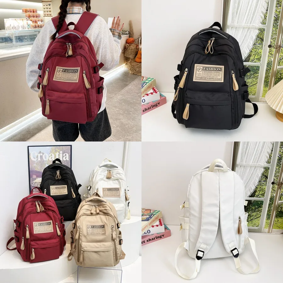 

【New style】Backpack women's four-season simple travel computer backpack male high school junior high school large capacity stud