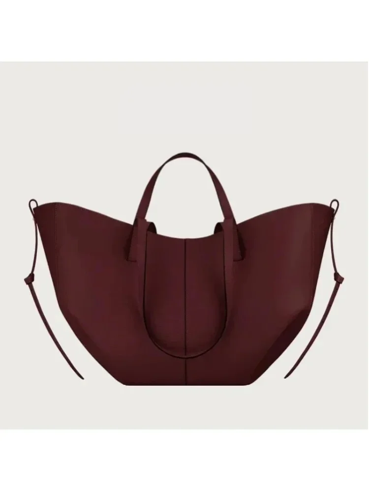 Retro-Chic Bucket-Handtasche, geräumiges Fassungsvermögen, als Unterarm- oder Schultertasche tragbar, zeitloses Modedesign.