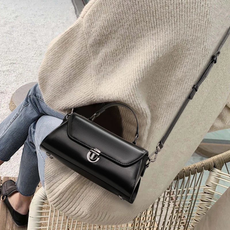 

Aidrani Black Leather Satchel: Sleek Design, Timeless Sophistication