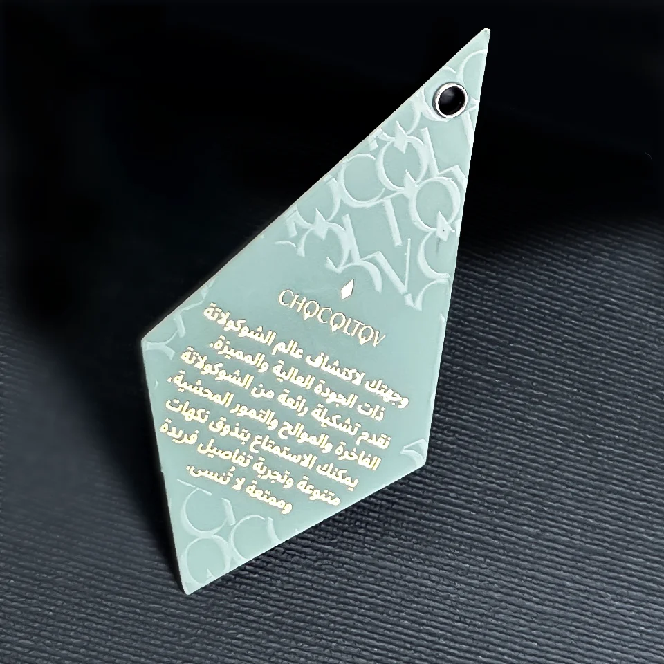 

Certified factory Haute couture white uv embossed paper label with clothing hangtags