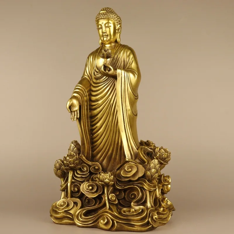 , standing on a , a bronze art piece, a lotus flower Shakyamuni Buddha