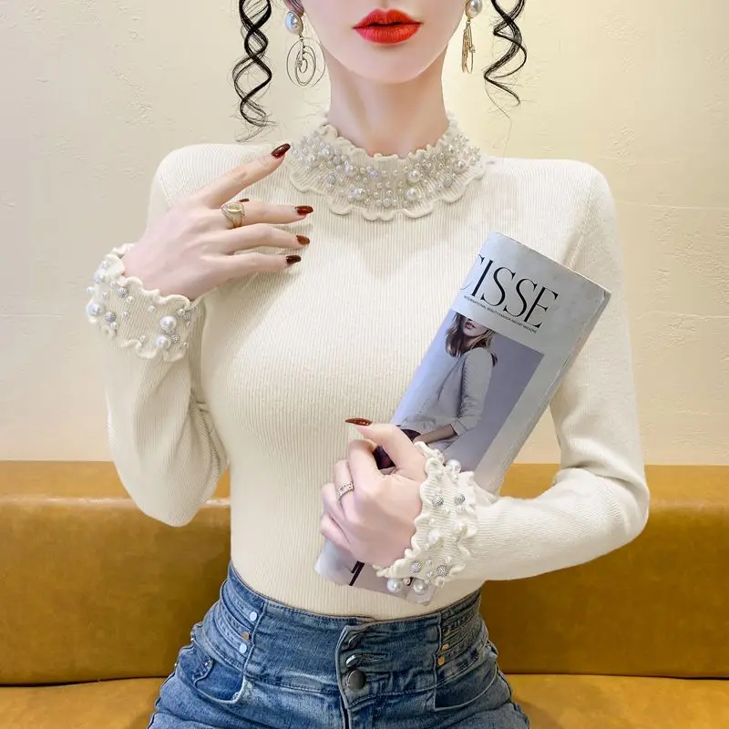 الكورية نمط شتاء جديد شبه عالية الياقة الدانتيل الصناعة الثقيلة مسمار حبة سميكة محبوك سترة المرأة أنيقة التخسيس