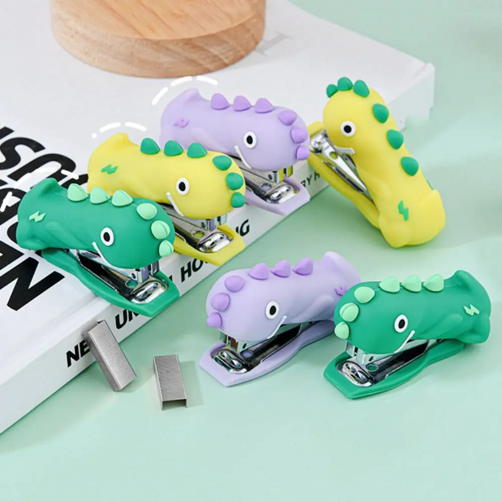 Mini grapadora de dinosaurios de dibujos animados, grapadora portátil decorativa de mano, herramienta de grapado de papel de silicona para escuela y oficina