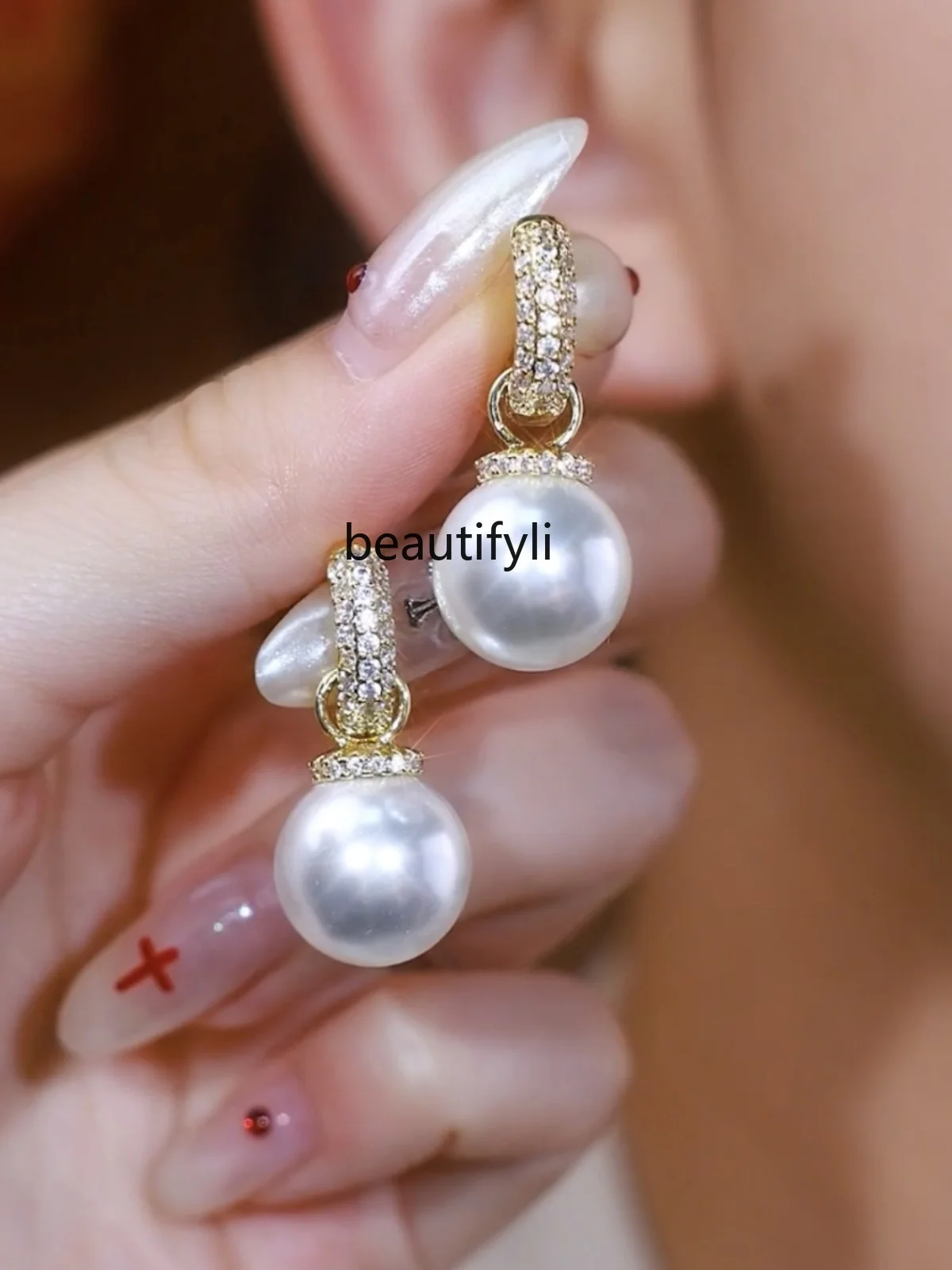 Light luxury high-end pearl earrings, new trendy temperament versatile earrings, niche design sterling silver earrings.