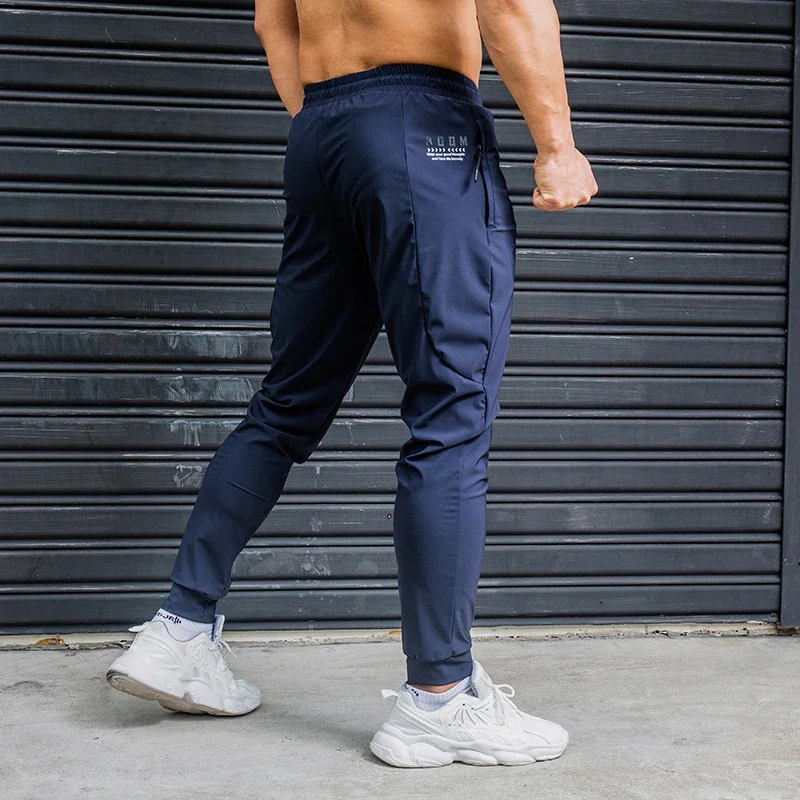 

Elasticity Men Running Pants Casual Sweatpants With Zipper Pockets Training Jogging Fitness Trousers Gym Workout Sport Pants