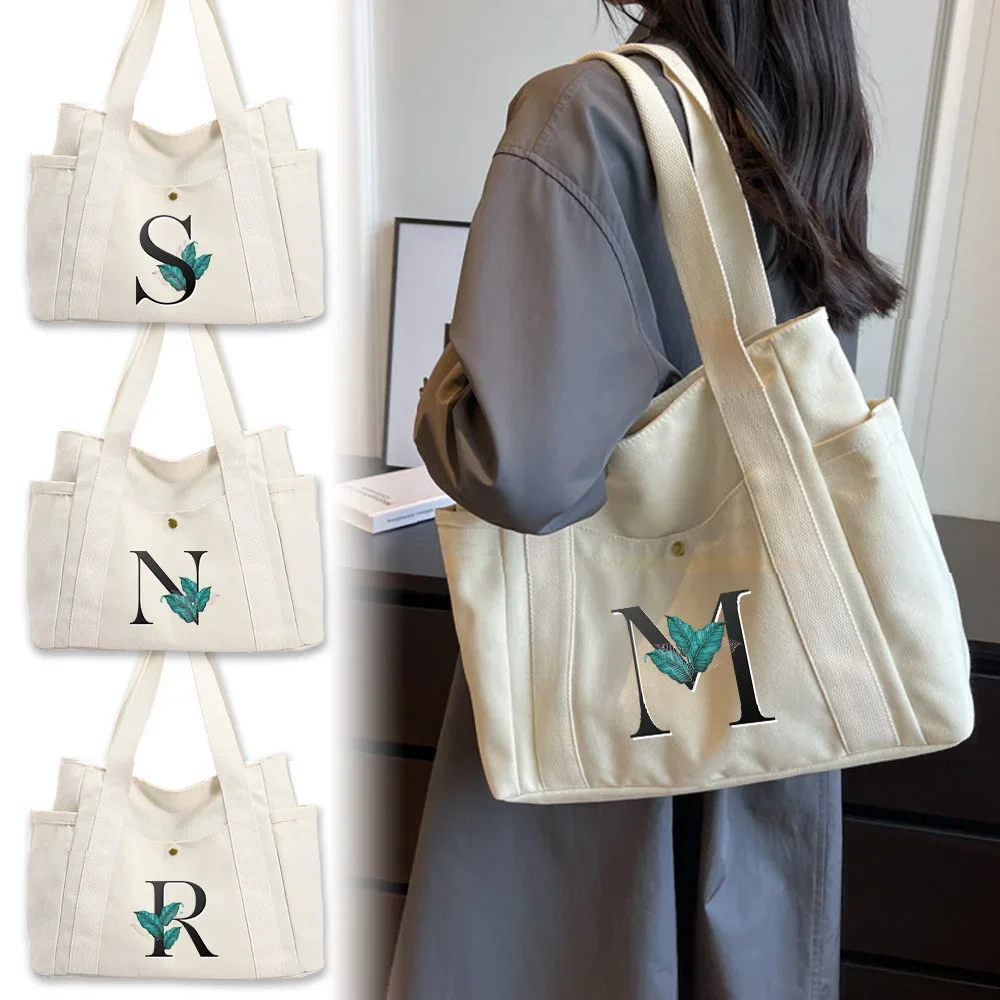 Front Snap-button Canvas Shoulder Tote Bag with Side Bottle Pocket Layout, Storage Bag for Water Bottles and Books on Outings.