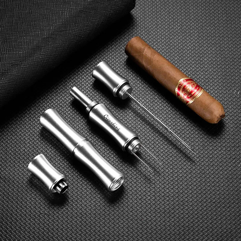 Multi functional cigar vent, ash holder, unclogger, pine smoke drill hole, opening hole, cigar needle