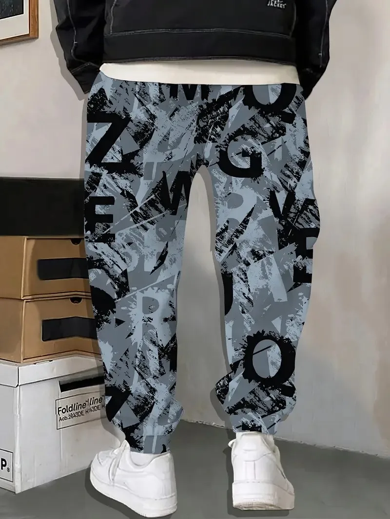 I nuovi pantaloni da uomo per la primavera e l'autunno del 2025 sono comodi, morbidi, casual e con stampe di lettere per pattinaggio a rotelle