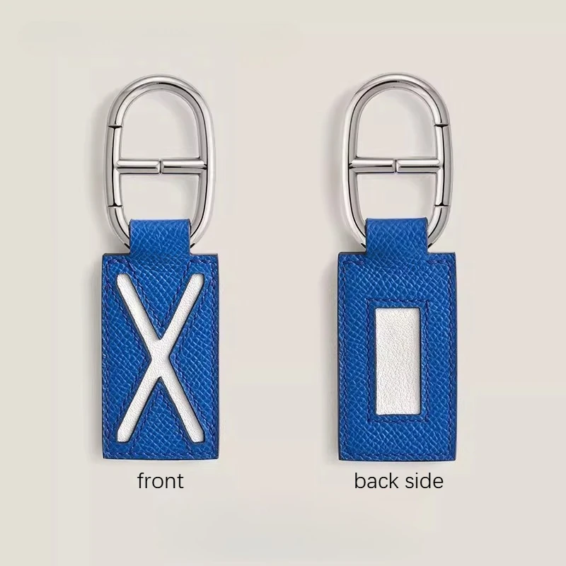 

2026 high-end two-color leather keychain handmade pig nose stainless steel buckle bag car pendant nameplate