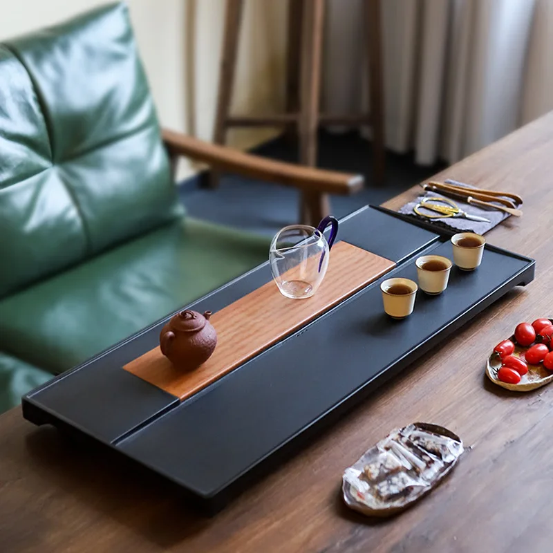 

New creative German imported high-end bakelite tea tray natural whole drainage Wujinshi tea table living room home