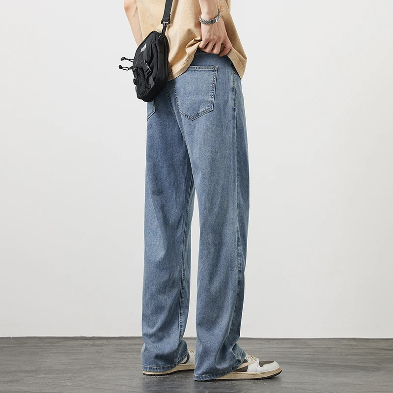 Letnie cienkie męskie Lyocell luźne proste dżinsy miękkie drapowanie lodowy jedwab Casual spodnie dżinsowe z szeroką nogawką moda koreańska moda uliczna