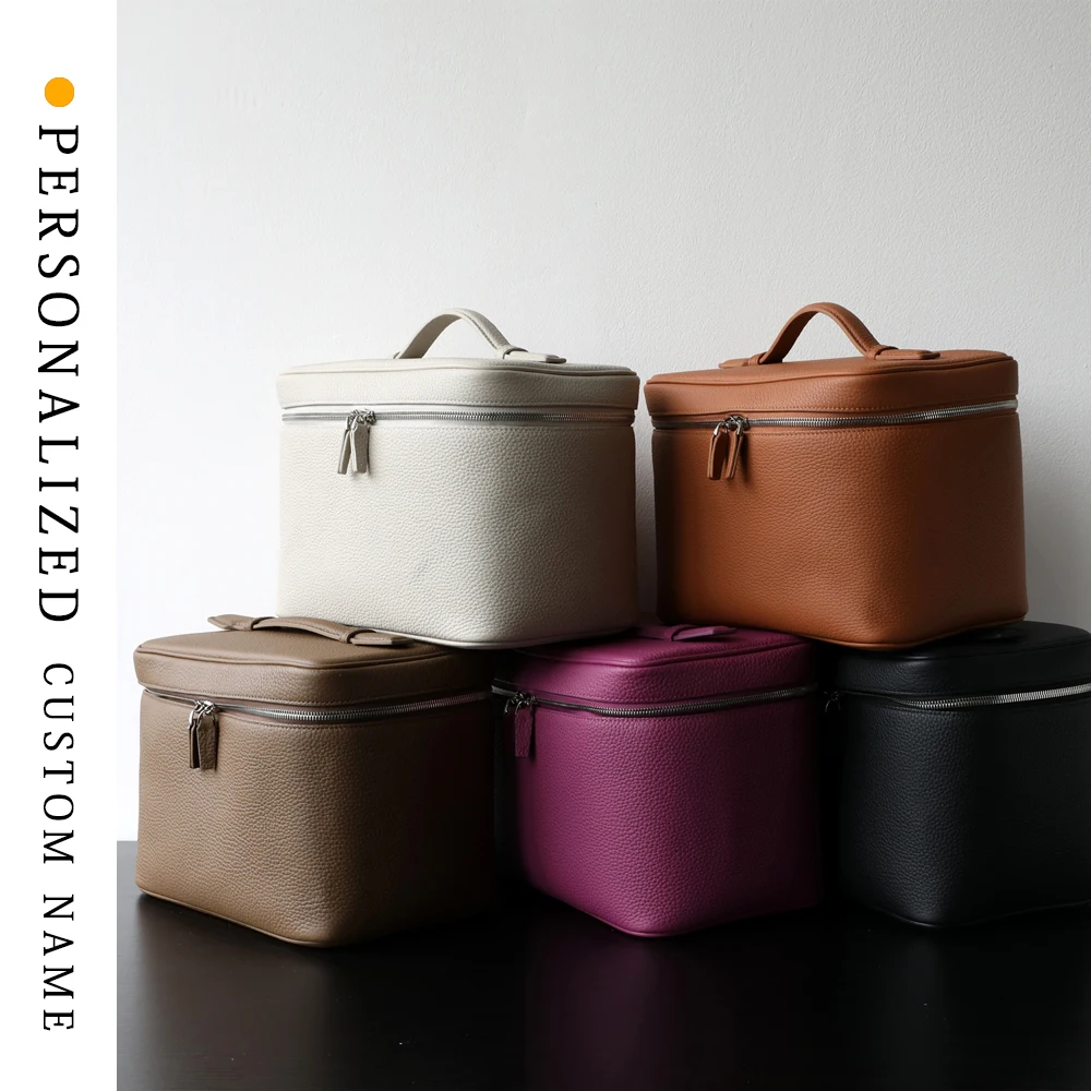 

Women's large-capacity cowhide hand storage makeup bag toiletry bag multi-grid travel makeup box support custom gold stamping