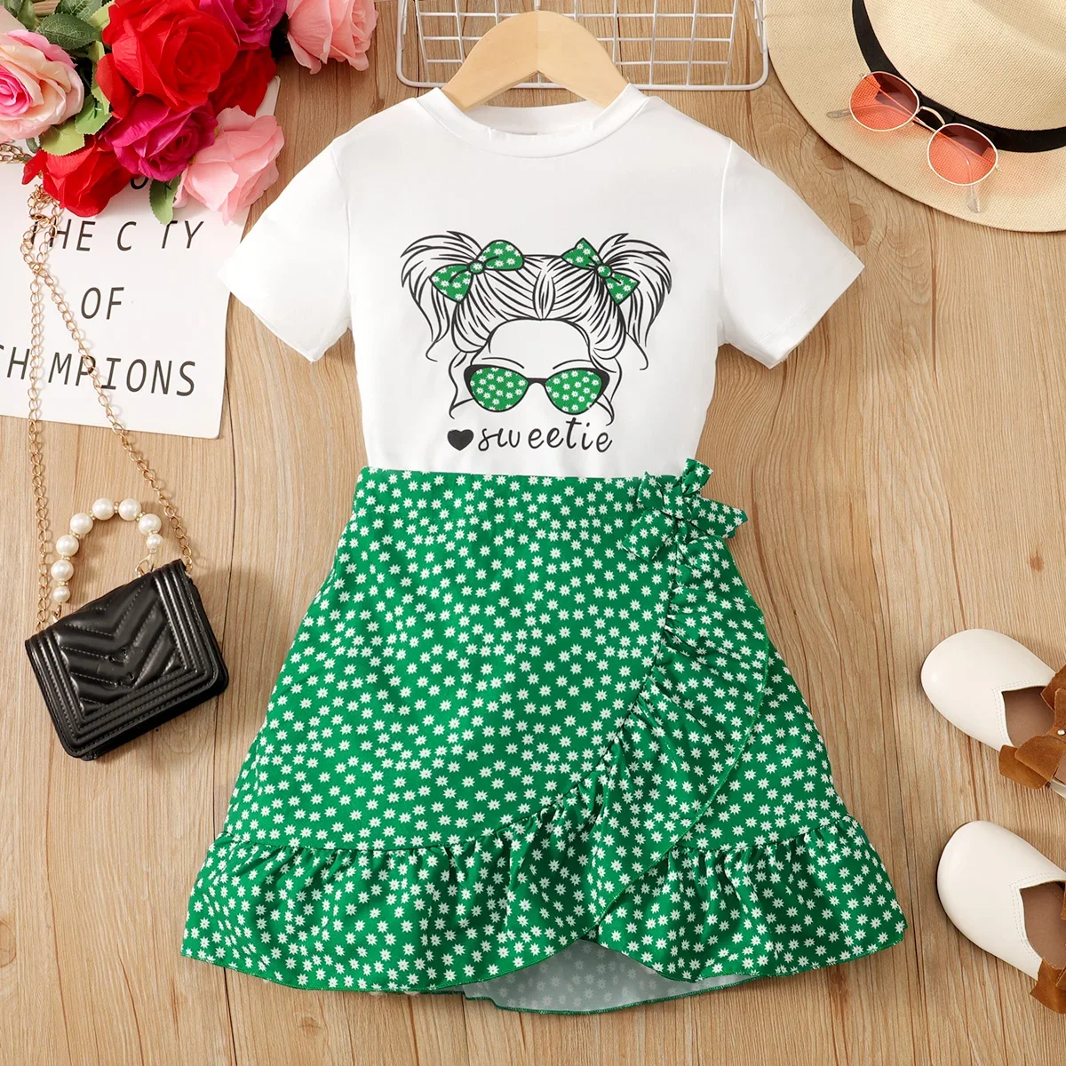 PatPat 2pcs Kid Girl Figure Print Short-sleeve Top and Polka Dots Ruffled Tie Side Wrap Skirt Set Soft and Comfortable