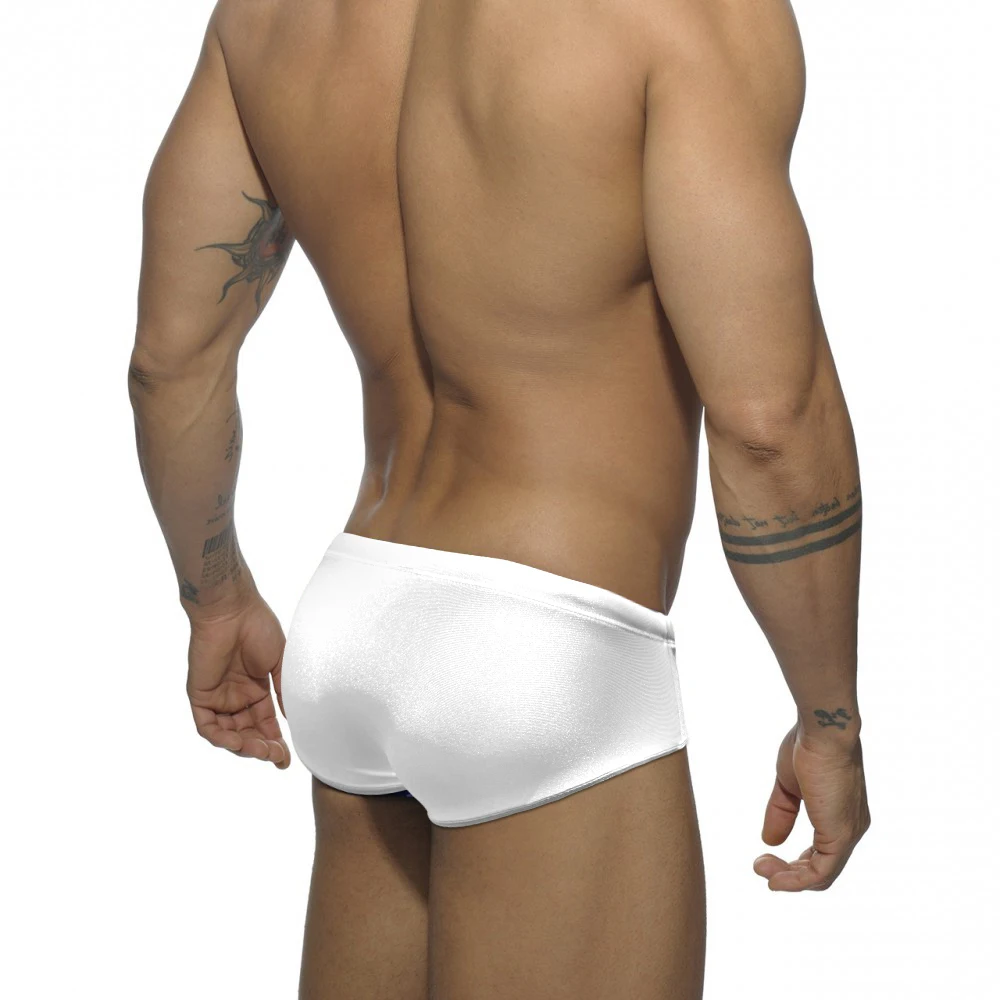 Bañador Sexy brillante para hombre, traje de baño transparente de secado rápido para surfear en la playa, bañador Gay de cintura baja, calzoncillos de realce con almohadilla sólida