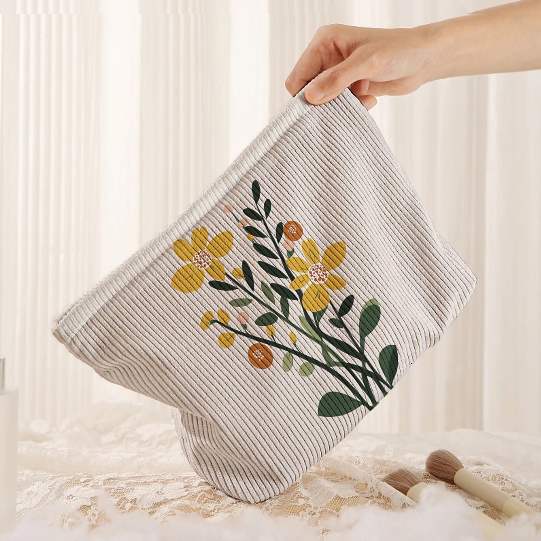 Makeup Bag with an Artistic and Fresh Design Featuring a Creamy White Base with Bright Yellow Small Flowers and Green Makeup Bag