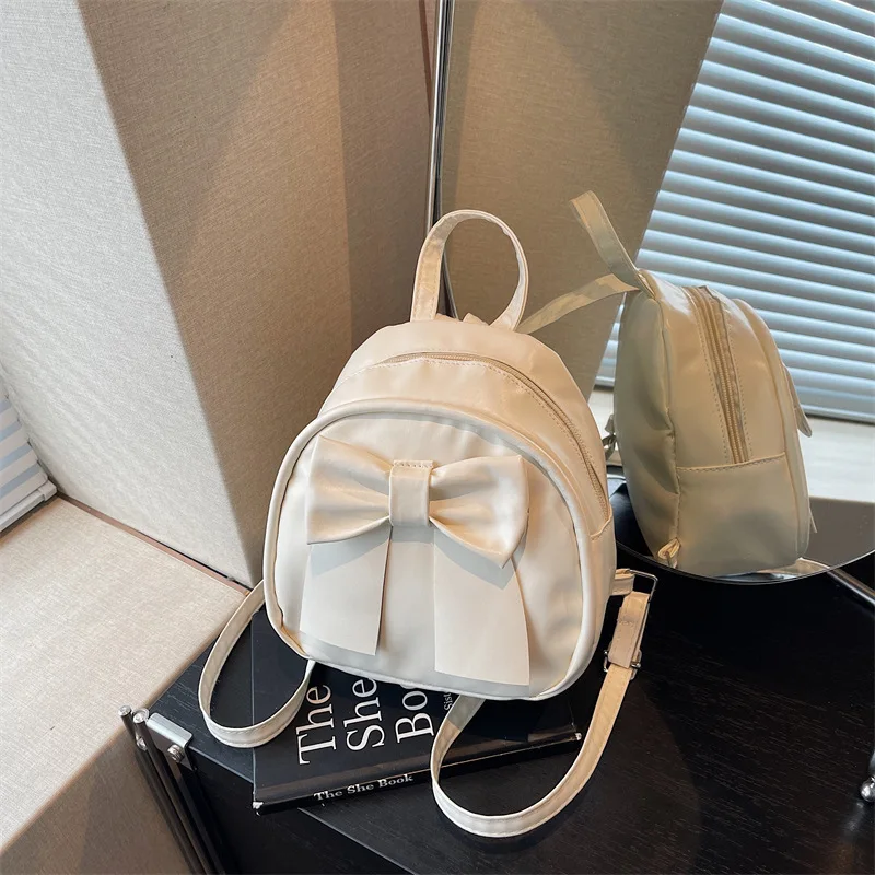 

Summer 2025 new niche bow backpack for women stylish and simple hand-held shoulder cross-body backpack